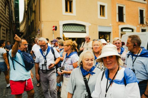 A tour group walking along a narrow European street